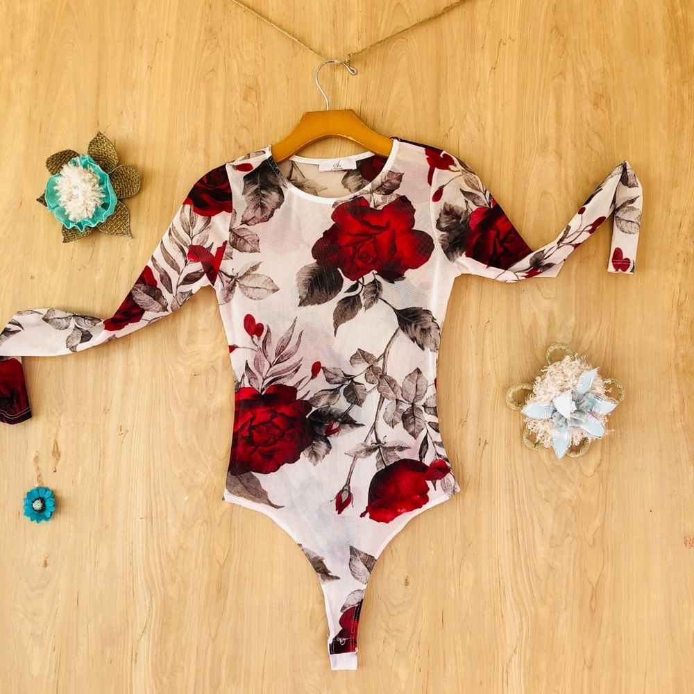 A white one pice with a red floral design.